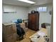 Basement area with wood-look floors features storage boxes and furniture at 290 W 1St Ave, Broomfield, CO 80020