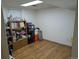 Unfinished basement area with wood-look floors, shelving and storage at 290 W 1St Ave, Broomfield, CO 80020