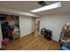 Unfinished basement area with wood-look floors and access to closet at 290 W 1St Ave, Broomfield, CO 80020