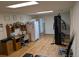 Spacious basement features wood-look floors, desk area, refrigerator and room for gym equipment at 290 W 1St Ave, Broomfield, CO 80020