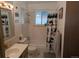 Well-maintained bathroom with a shower-tub combo, vanity sink, and natural-themed decor for a calming space at 290 W 1St Ave, Broomfield, CO 80020