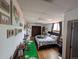 Bedroom with window and hardwood flooring, features a queen bed and wall art at 290 W 1St Ave, Broomfield, CO 80020