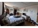 Bedroom with window and hardwood flooring, features a queen bed and white dresser at 290 W 1St Ave, Broomfield, CO 80020