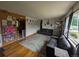 Cozy living room with hardwood floors, natural light, and comfortable seating area, creating a welcoming atmosphere at 290 W 1St Ave, Broomfield, CO 80020