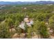 Stunning aerial view of a home nestled among lush greenery, offering privacy and beautiful natural surroundings at 1943 Columbine Ct, Golden, CO 80401