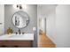 Charming half-bathroom with a mosaic wall and hardwood floors at 1943 Columbine Ct, Golden, CO 80401