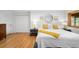 Comfortable bedroom with natural light, hardwood floors, and a serene atmosphere for relaxation at 1943 Columbine Ct, Golden, CO 80401