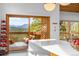Stunning view from the kitchen to the deck, showcasing mountain scenery and outdoor seating at 1943 Columbine Ct, Golden, CO 80401