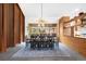 Elegant dining room with modern chandelier, wooden accents, and ample natural light at 1943 Columbine Ct, Golden, CO 80401