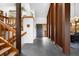 Inviting foyer with wooden accents, slate flooring, and an open staircase at 1943 Columbine Ct, Golden, CO 80401