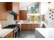 Well-appointed kitchen featuring stainless steel appliances, wood cabinetry, and a seamless design at 1943 Columbine Ct, Golden, CO 80401