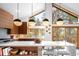 Modern kitchen with a large island, pendant lighting, and expansive windows offering outdoor views at 1943 Columbine Ct, Golden, CO 80401