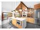 Bright, modern kitchen featuring a large island, stainless steel appliances, and mountain views at 1943 Columbine Ct, Golden, CO 80401