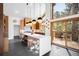Bright modern kitchen with a large island, stainless steel appliances, and access to an outdoor deck at 1943 Columbine Ct, Golden, CO 80401