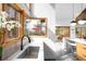 Bright kitchen features modern design, stainless steel sink, and a window with a view of the outdoor deck at 1943 Columbine Ct, Golden, CO 80401