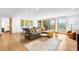 Spacious living room with a large sectional, hardwood floors, and walk-out deck at 1943 Columbine Ct, Golden, CO 80401