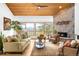 Cozy living room with a stone fireplace, large windows, and comfortable seating at 1943 Columbine Ct, Golden, CO 80401