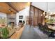 Open-concept living space with a stone fireplace, vaulted ceiling, and adjacent dining area at 1943 Columbine Ct, Golden, CO 80401