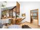 Bright entryway featuring beautiful stairs, wood accents, stylish décor, and a glimpse into another room at 1943 Columbine Ct, Golden, CO 80401