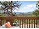 Scenic view of mountains and forest from a deck with a seating area at 1943 Columbine Ct, Golden, CO 80401