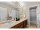Bathroom features a double sink vanity with a large mirror and a shower and tub combo at 2776 Badlands Ct, Castle Rock, CO 80109