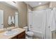 Bathroom with a shower-tub combo, light brown walls, and a vanity with a sink, designed for everyday convenience at 2776 Badlands Ct, Castle Rock, CO 80109
