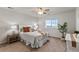 Cozy bedroom features a large window, neutral colored walls, with light colored carpet flooring at 2776 Badlands Ct, Castle Rock, CO 80109