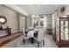 Bright dining room with round table, chandelier, and natural light at 2776 Badlands Ct, Castle Rock, CO 80109