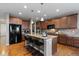 Gourmet kitchen with island seating, granite countertops, and stainless steel appliances at 2776 Badlands Ct, Castle Rock, CO 80109