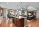 Open concept kitchen with granite island and stainless steel appliances flows into the living area at 2776 Badlands Ct, Castle Rock, CO 80109