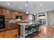 Spacious kitchen features an island with bar seating, granite countertops, and stainless steel appliances at 2776 Badlands Ct, Castle Rock, CO 80109