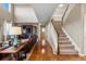 Inviting living room with soaring ceilings, hardwood floors, and staircase at 2776 Badlands Ct, Castle Rock, CO 80109