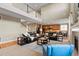 Open-concept living area with high ceilings, kitchen view, and staircase at 2776 Badlands Ct, Castle Rock, CO 80109