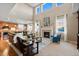 Spacious living room with fireplace, comfortable seating, and large windows at 2776 Badlands Ct, Castle Rock, CO 80109