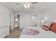 Bright bedroom with neutral tones, a ceiling fan, carpet, and access to a bathroom, perfect for relaxation at 2776 Badlands Ct, Castle Rock, CO 80109
