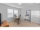 Bright home office offers a window with blinds, desk, chair, and plenty of natural light at 2776 Badlands Ct, Castle Rock, CO 80109