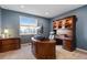 Office with custom wood built-ins, offering a functional and stylish workspace at 2776 Badlands Ct, Castle Rock, CO 80109
