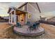 Backyard stone patio with comfortable outdoor seating, perfect for enjoying the outdoors and entertaining guests at 2776 Badlands Ct, Castle Rock, CO 80109