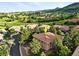 Aerial view of house in Arrowhead, close to golf course and red rock formations at 10751 Fairway Vistas Ct, Littleton, CO 80125