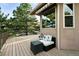Relaxing back deck featuring outdoor seating and landscaping for serene outdoor enjoyment at 10751 Fairway Vistas Ct, Littleton, CO 80125