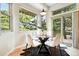 Cozy breakfast nook with a glass table, seating for four, and abundant natural light at 10751 Fairway Vistas Ct, Littleton, CO 80125