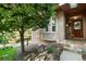 Welcoming front entrance features a stone pathway, manicured landscaping, and a classic wooden door at 10751 Fairway Vistas Ct, Littleton, CO 80125