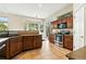Bright and functional kitchen with stainless steel appliances, wooden cabinets, and tiled floors at 10751 Fairway Vistas Ct, Littleton, CO 80125