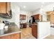 Well-equipped kitchen with ample counter space, stainless steel appliances, and adjacent dining area at 10751 Fairway Vistas Ct, Littleton, CO 80125