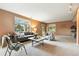 Inviting living area with a comfortable sofa, plush chairs, stylish decor, and lots of natural light at 10751 Fairway Vistas Ct, Littleton, CO 80125