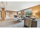 Open living area with modern furnishings, neutral color palette, and large windows offering abundant natural light at 10751 Fairway Vistas Ct, Littleton, CO 80125
