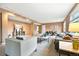 Spacious living room with neutral tones, recessed lighting, comfortable seating and ample space for relaxation at 10751 Fairway Vistas Ct, Littleton, CO 80125