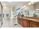 Luxury main bathroom with soaking tub, granite countertop, and modern fixtures at 10751 Fairway Vistas Ct, Littleton, CO 80125