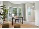 Bright office space with natural light, desk, chair, and comfortable ottomans creating a productive workspace at 10751 Fairway Vistas Ct, Littleton, CO 80125