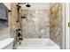 Elegant bathroom with tiled shower, rainfall showerhead, and modern fixtures offering a spa-like experience at 10751 Fairway Vistas Ct, Littleton, CO 80125